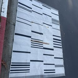 Patio Rug – Good Condition Overall, Has Rust Stains (See Photos)