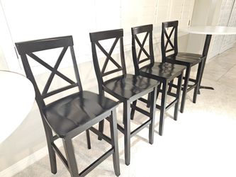 4 black bar height chairs/stools