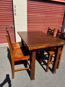 Wooden high table and four chairs
