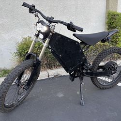 Electric moto stealth bomber surron battery