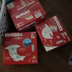 3 Boxes Of Size 2 Huggies Diapers 