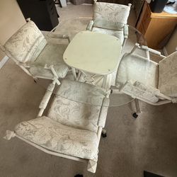 Glass Dining Room Table With Rolling Chairs 