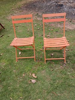 2 Metal Orange Chairs