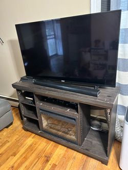 TV stand w/fireplace feature and TV