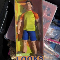 Barbie looks Ken