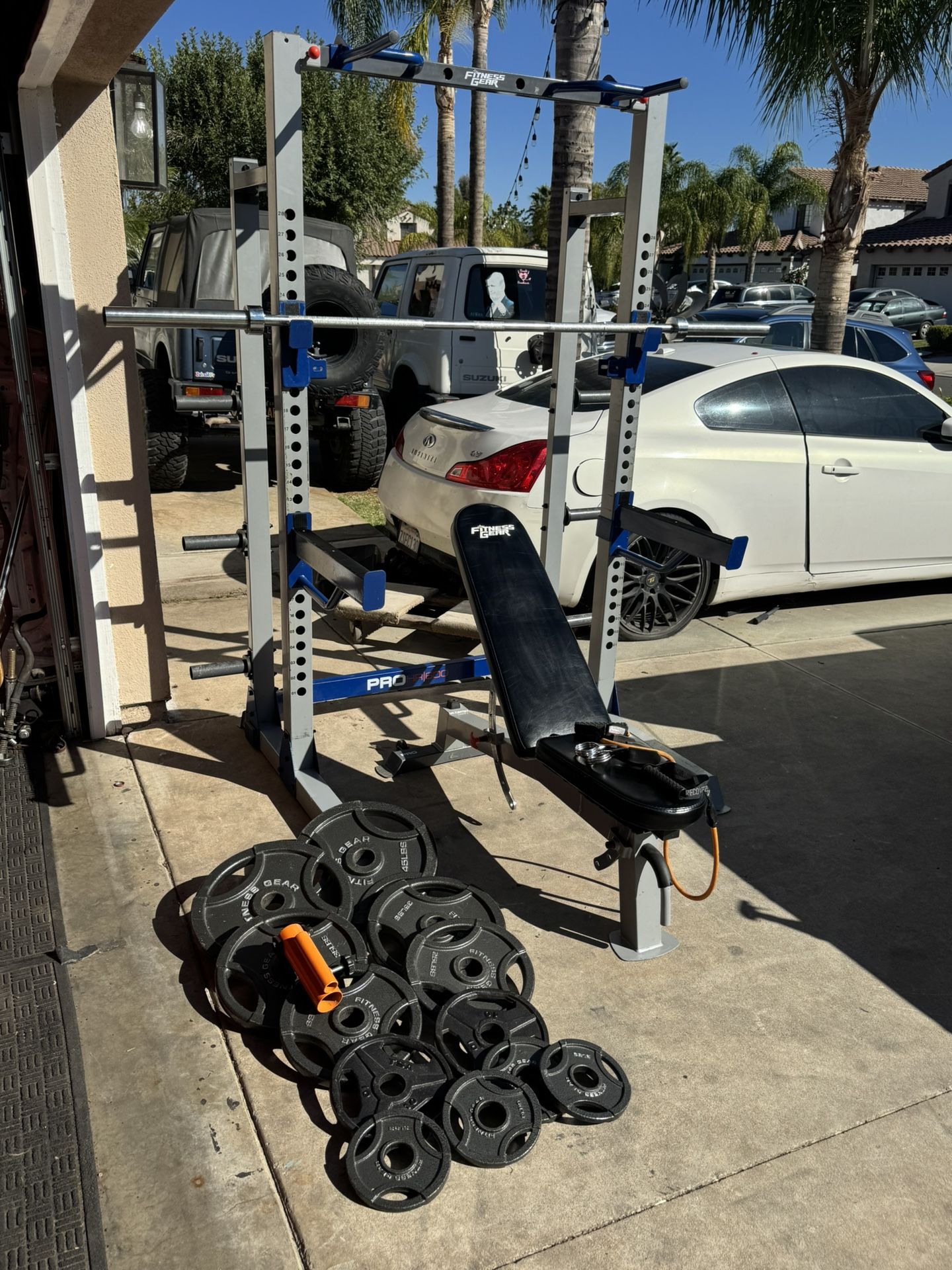 Fitness gear bench press/squat rack with 7ft 45lbs bar plus 250lbs of Olympic of weights