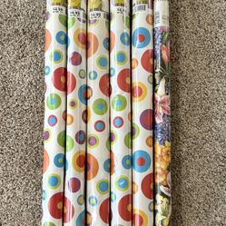 6 NEW rolls of Wrapping Paper. 5 are same with an “All Occasion” design & also 1 with floral look.