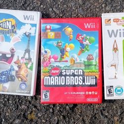 4 WII GAMES IN LIKE NEW CONDITION SUPER MARIO,ZELDA TWILIGHT PRINCESS,WII FIT PLUS RAYMAN