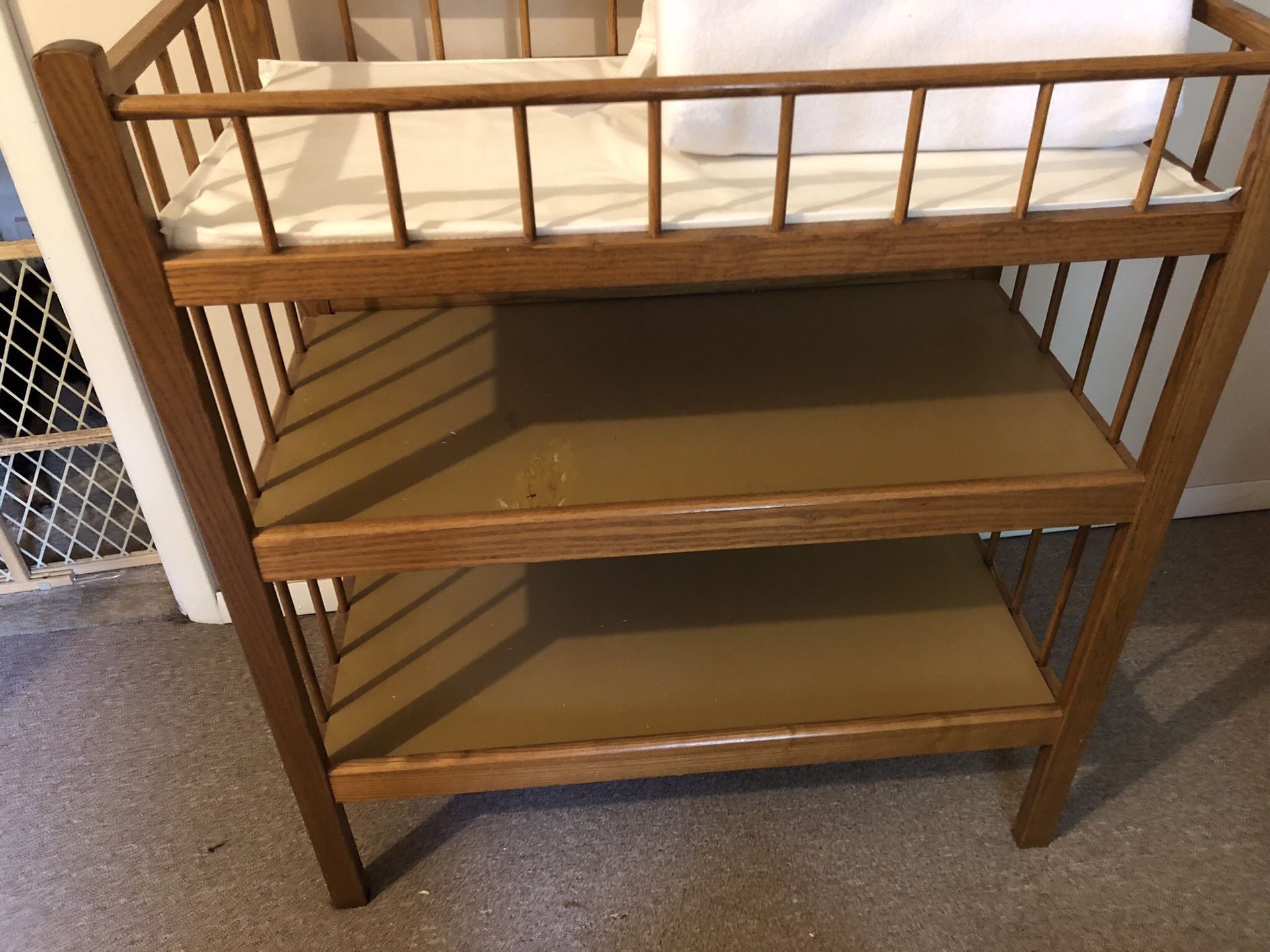 Changing table with pad and cover. Not used often. (Nursery for my grandson when he came to visit) Spot on table from lotion that leaked. Moving sale