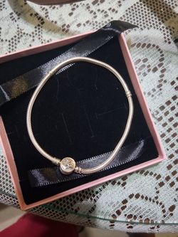 Brand new, never used authentic Pandora Moments snake chain bracelet. Two-tone classic round clasp (silver and gold tones). Comes in its original pink