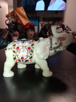 Jeweled Elephant Figurine (Trunk Up for Good Luck)Description:Beautiful vintage cream/ivory colored resin elephant figurine featuring a raised trunk, 