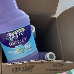 Swiffer WetJet Mop with 4 bottles of cleaning solution 