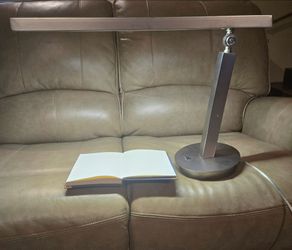 Industrial minimalist, geometric linear LED desk lamp.