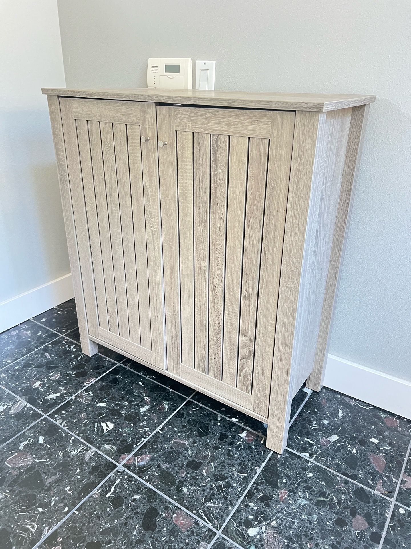 Small cabinet. Great for shoes.