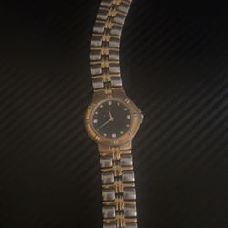 Bulova Gold Watch With Steel Water Resistant.
