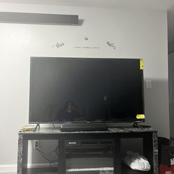 A 70 Inch TV Stand with 26 Inch Fireplace, Glass Shelf’s, And Led Lights. Combo