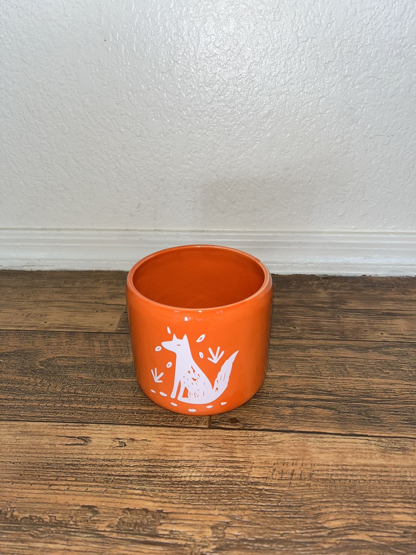 Orange Ceramic Pot With White Fox