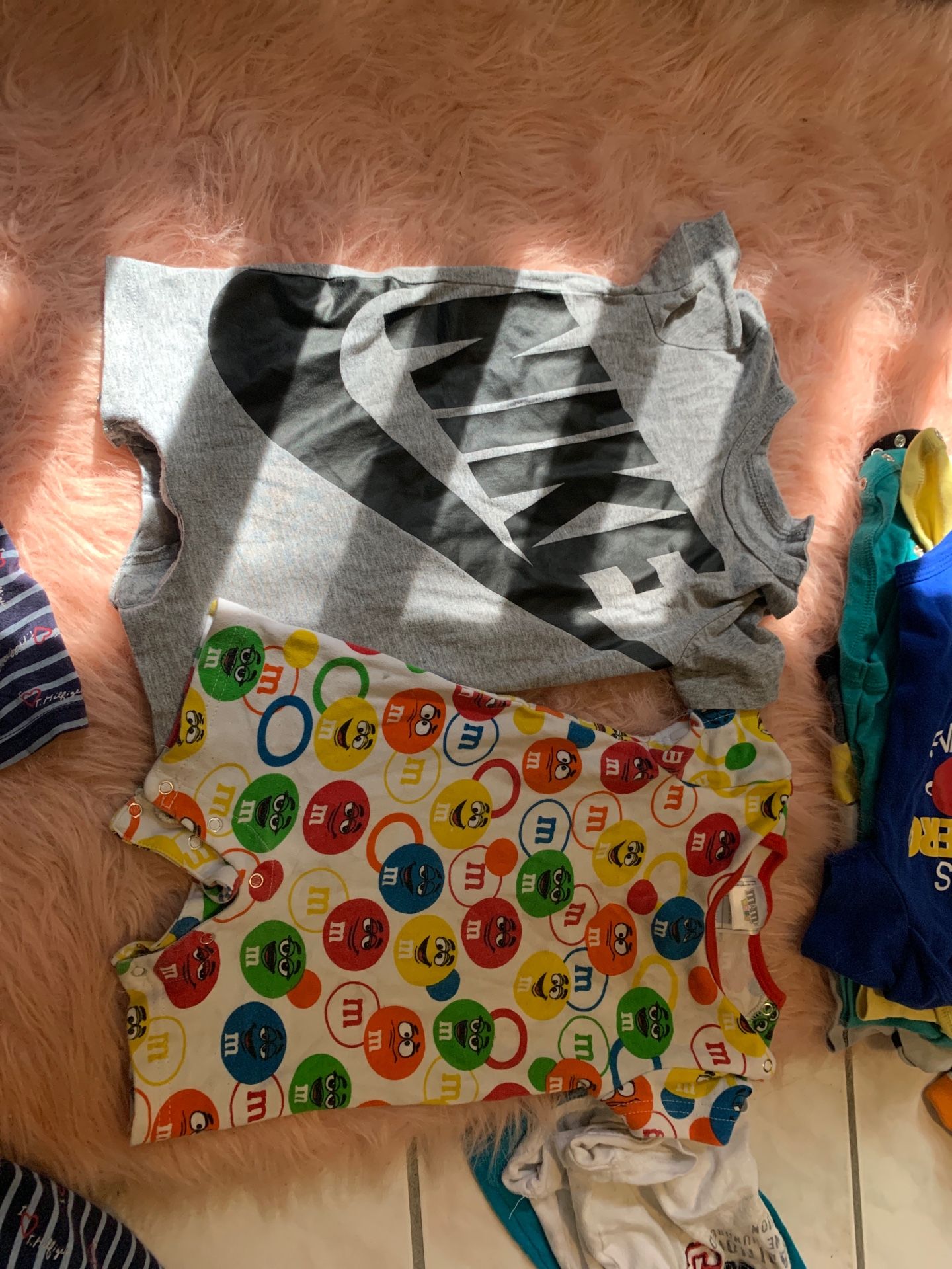 Nike and M&M onesies asking $6 for both great condition