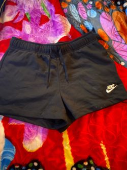 Women’s Nike standard fit mid-rise sweat shorts feature a simple black design Size M