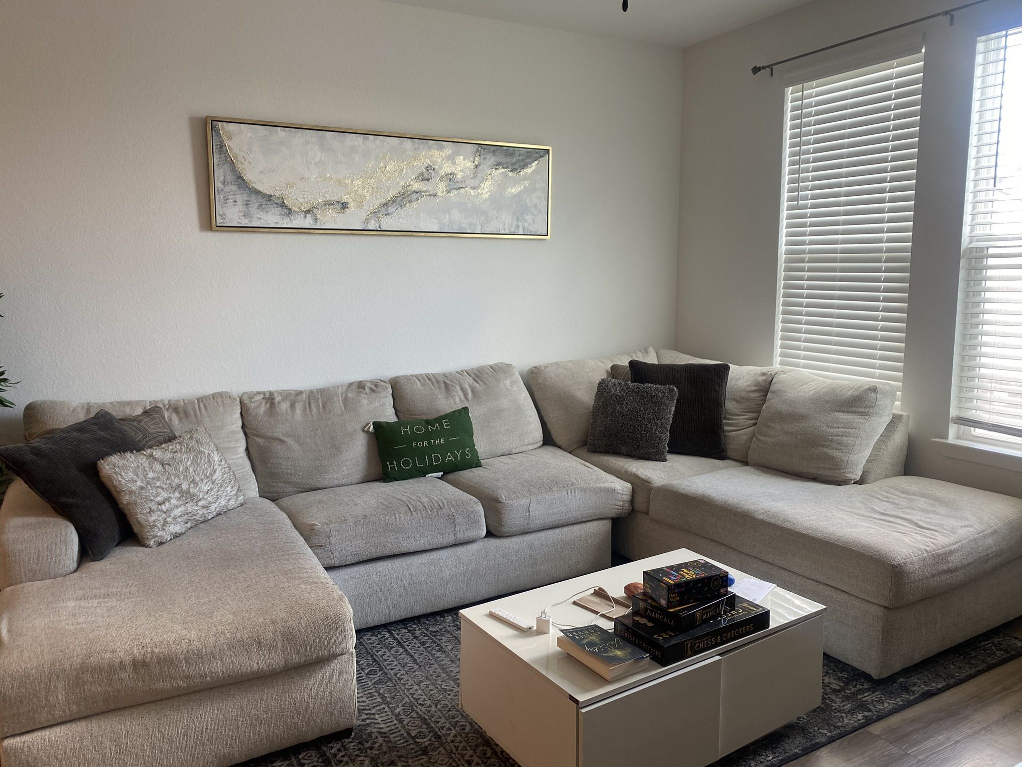 Beige Sectional Couch With A Chaise.