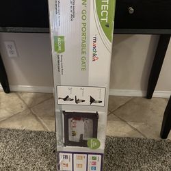 Munchkin fold and go portable gate