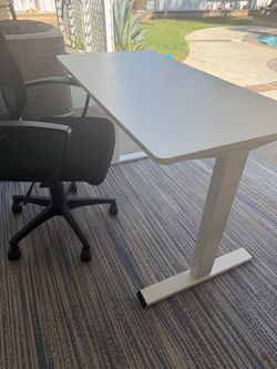 47” adjustable height desk non electronic and Chair