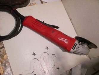MILWAUKEE 4"X 1/2 " CORDED ANGLE GRINDER $40 .00
