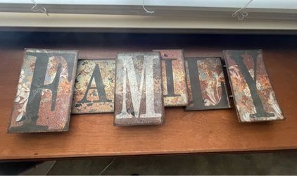 Rustic metal sign that says Family