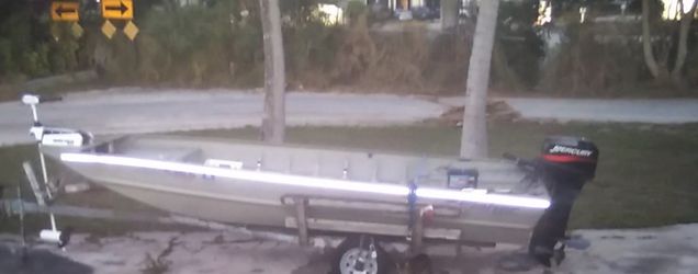 16x48 Fisher All Welded Jon Boat Has Pedetal Seats With Trailer