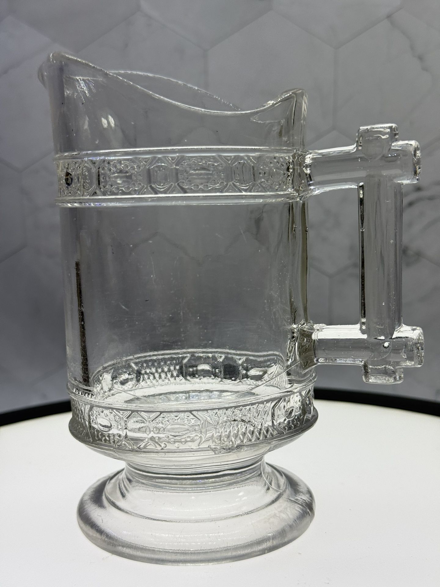 This is an antique Early American Pressed Glass (EAPG) creamer in the "Two Bands" pattern, manufactured by Doyle & Co. or LaBelle & Co. around the 188
