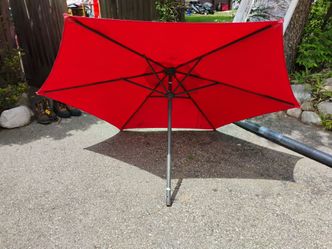 Three outdoor patio table umbrellas