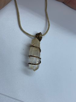 Clear quartz crystal stone single termination pendant. Extremely popular metaphysically, Clear Quartz is the most versatile healing stone among all c