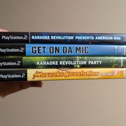 PlayStation 2 Set Of 4 Microphones And 4 Games
