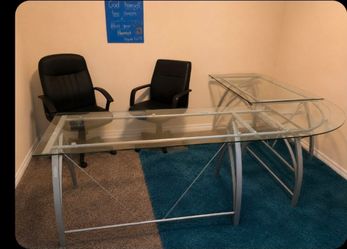 L shape glass office table.