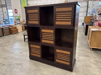 PIER 1 IMPORTS Dark Finished Sliding Door Bookcase with Mixed Tone Slatted Door Fronts