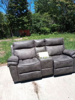 2 double recliners with cupholders and storage