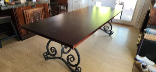 Wrought iron and solid brass base dining table