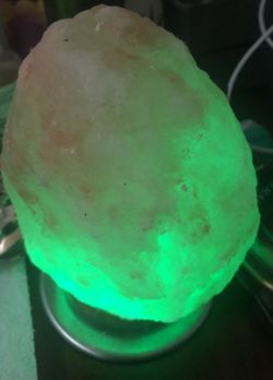 Multicolor glowing Himalayan salt lamp.