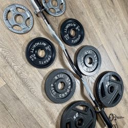 Beautiful BRAND NEW  Equipment: Curl Bar W/Cooper Bearings & Pair of Weight Plates 25s, 10s, 5s And 2.5 Pounds. (Total: 105 lbs)