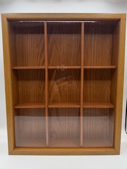wooden shadow box or curio display shelf with a clear acrylic front