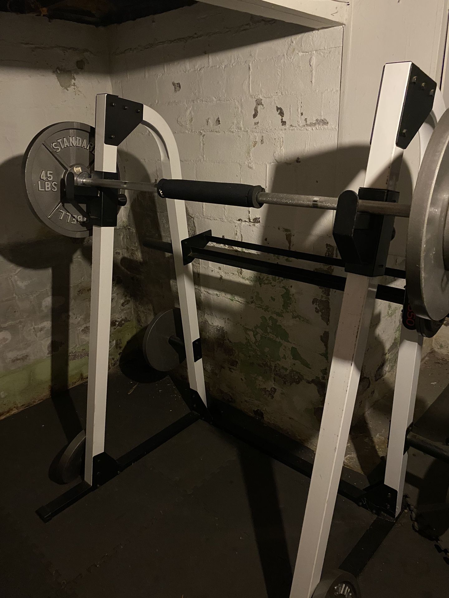 Squat cage rack with bar and weights 