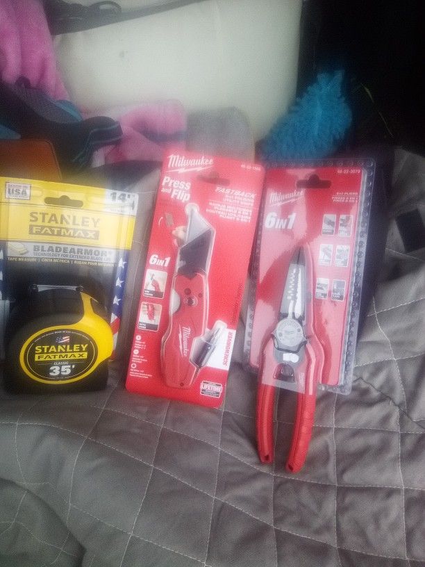 35 Ft Fat Max Tape, Milwaukee Knife With Phillips Screwdriver End And A Milwaukee 6 In 1 Multi Tool