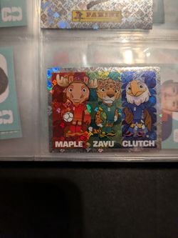 Panini 2026 World Cup Holographic Sticker.  Maple, Zayu and Clutch Mascots