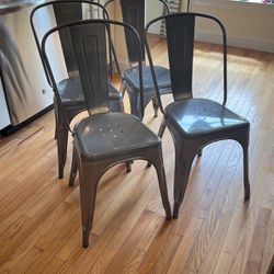 Four Clear Coated Metal Indoor Stackable Chair