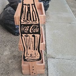 2 wooden Coke shelves.