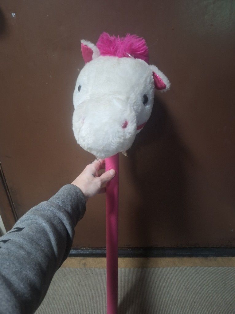 Pink And White Horse with Stick
