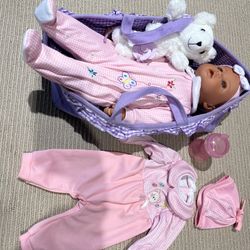 Baby doll with accessories and clothing