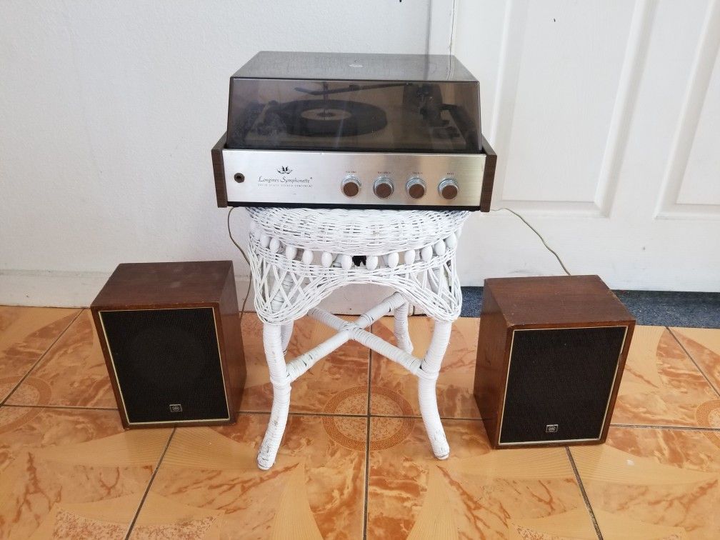 Solid state stereo component record player with speakers