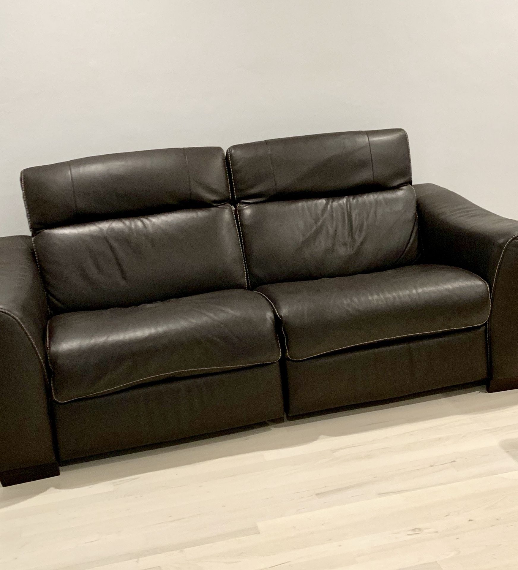 Brown leather recliner sofa