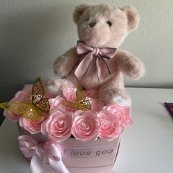 Box of roses with a teddy bear